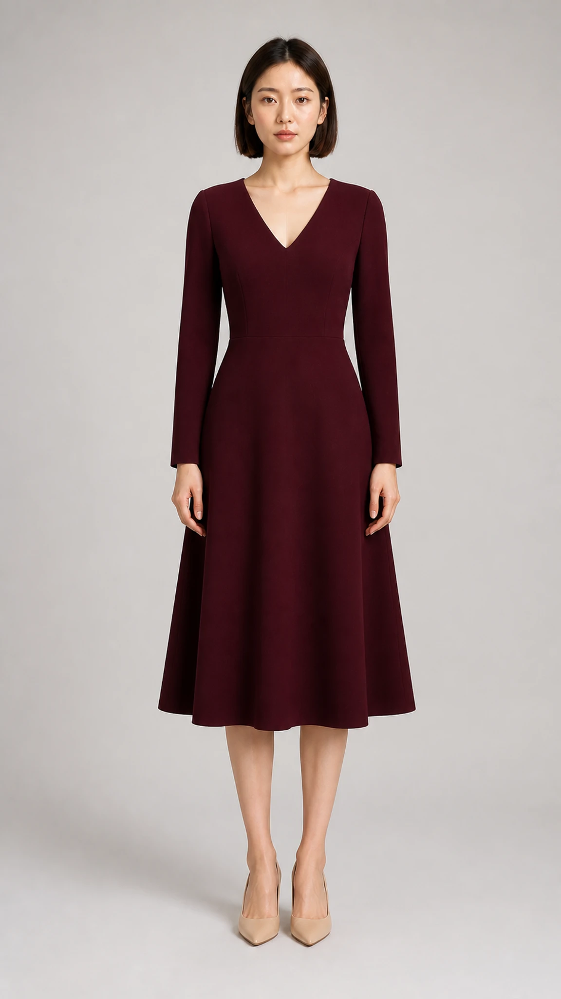 Front appearance reference of an adult woman wearing a burgundy midi dress